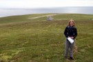 Debbie With Bonxie Stick, Foula, Airport In Background